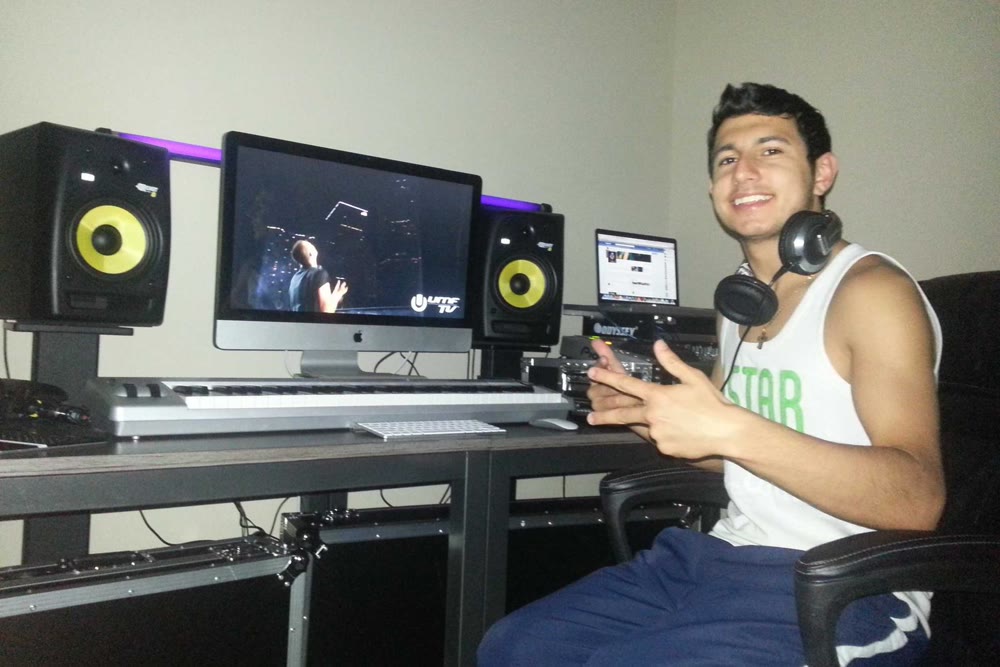 Paul working at his studio desk, monitors and keyboard in front of him